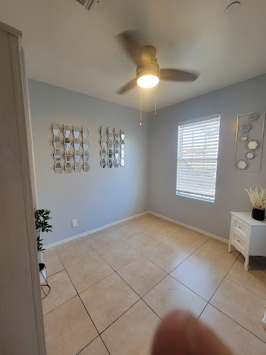 A bright and minimalist room featuring modern decor and wall art.