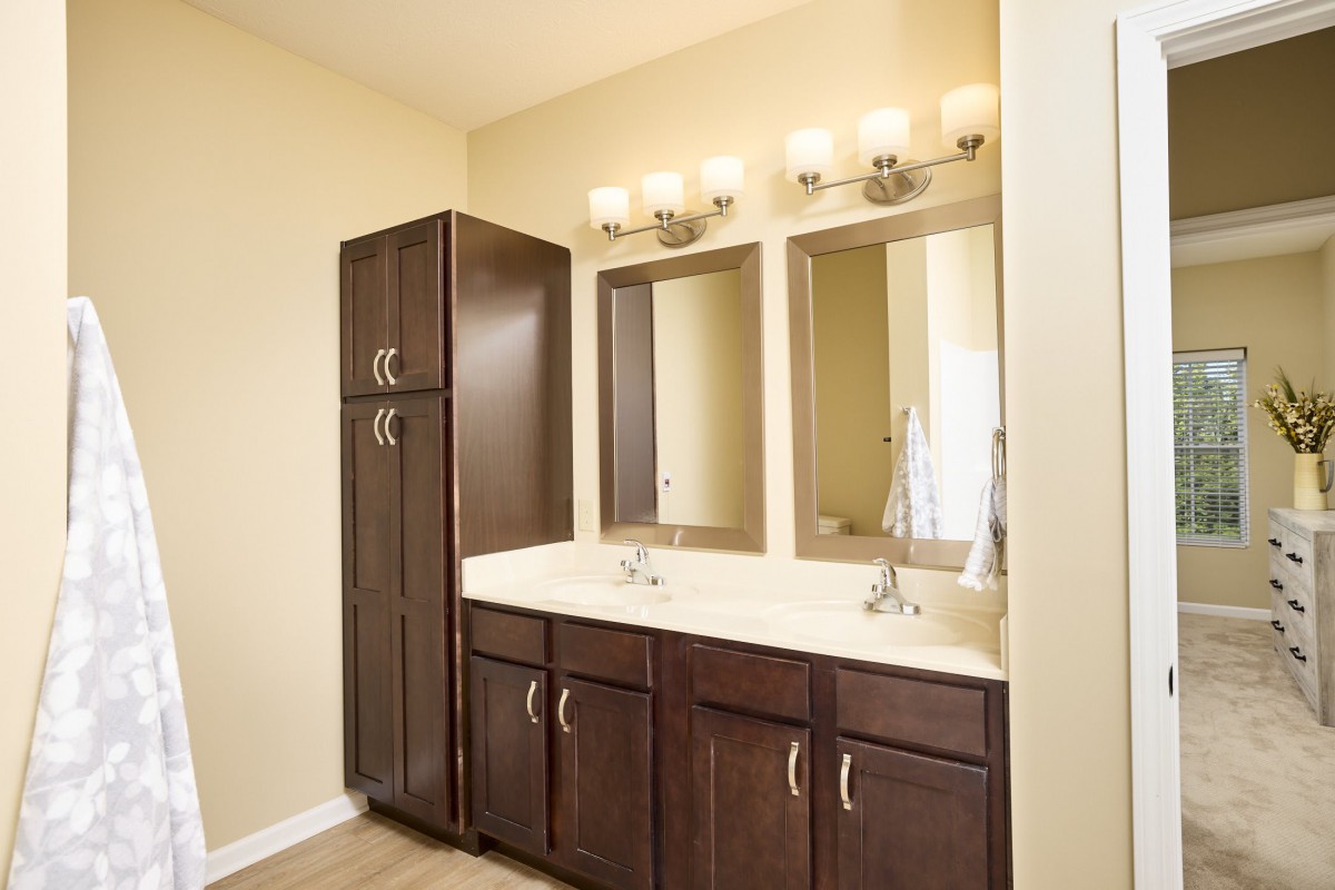 Modern bathroom with a double-sink vanity and stylish cabinetry.