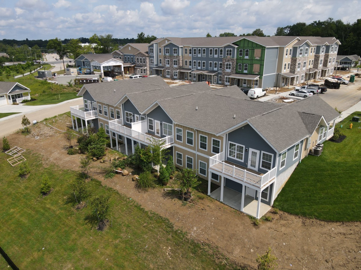 Aerial view of a modern residential apartment complex in a suburban area.