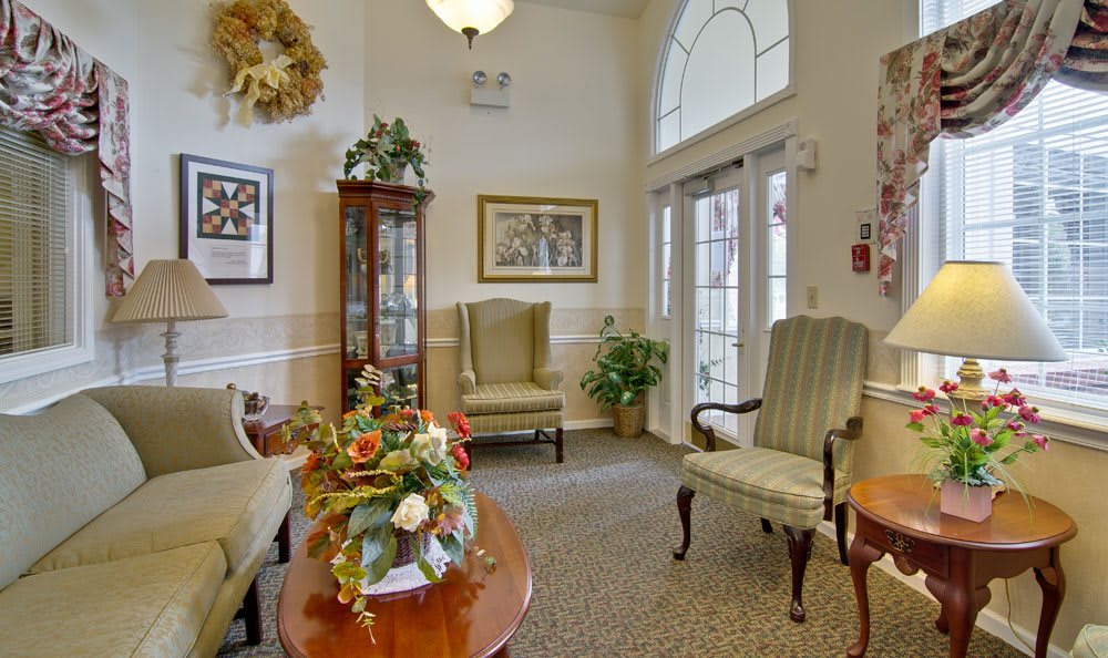 A cozy living room with classic-style furniture and decor.