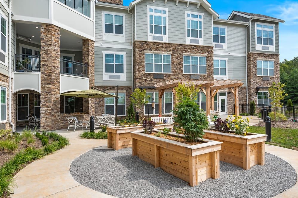 Modern apartment complex featuring landscaped outdoor areas.