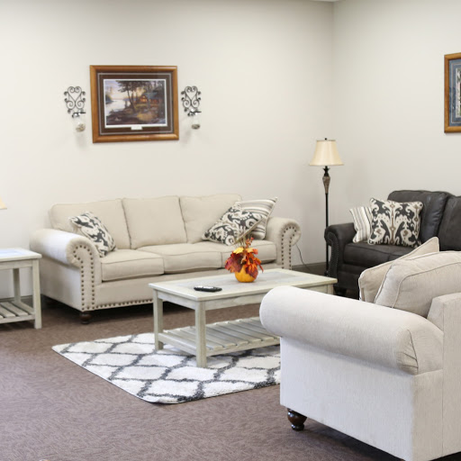 A cozy living room setup with neutral-toned furniture and decorative accents.