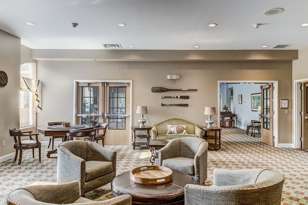 A spacious and elegantly designed lounge area with modern furniture and decor.