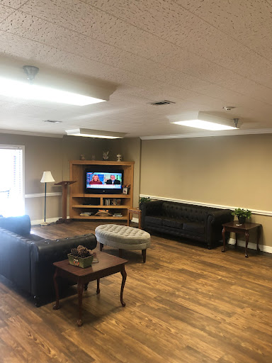 A cozy living room setup featuring comfortable sofas and a television.