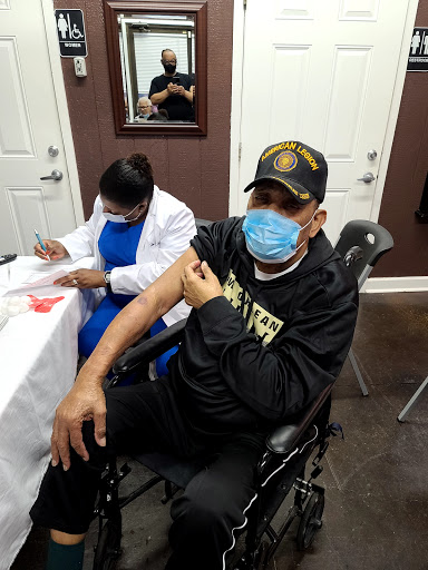 A patient receiving a vaccination in a healthcare setting.