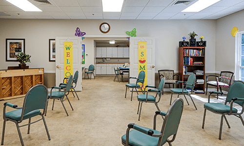A welcoming waiting room with arranged chairs and colorful decorations.