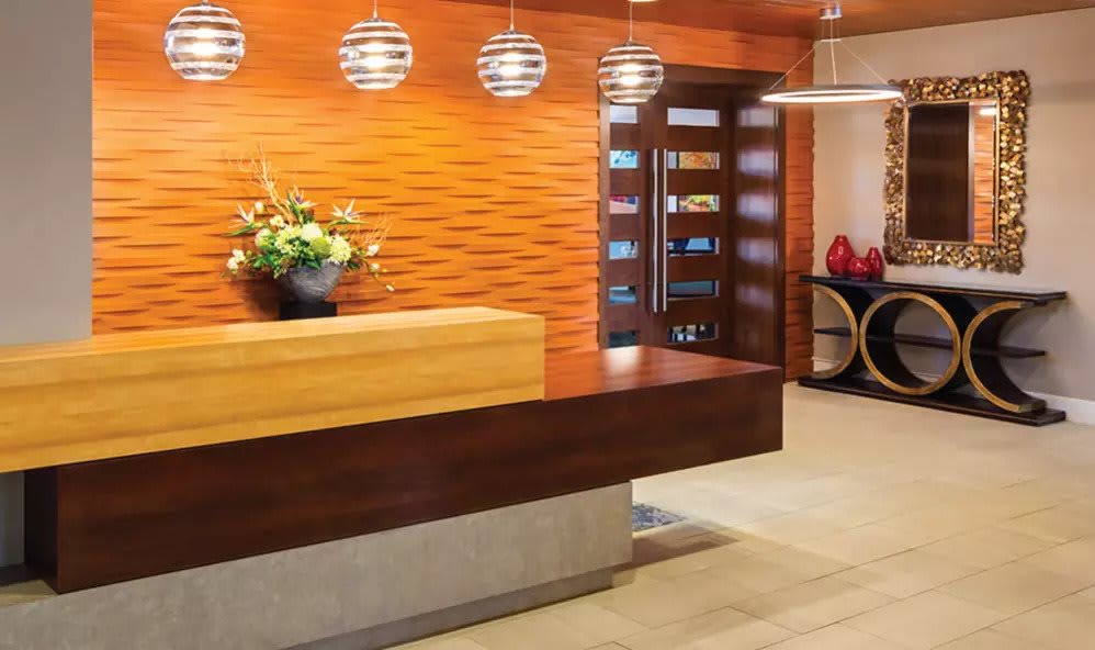 A modern reception area with wooden furniture and stylish decor.