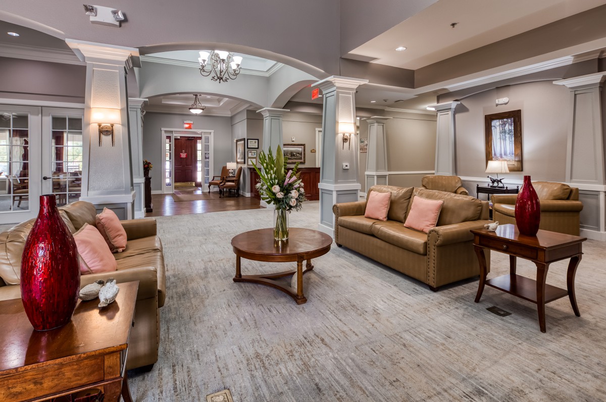 A spacious and elegantly designed lobby with comfortable seating and sophisticated decor.