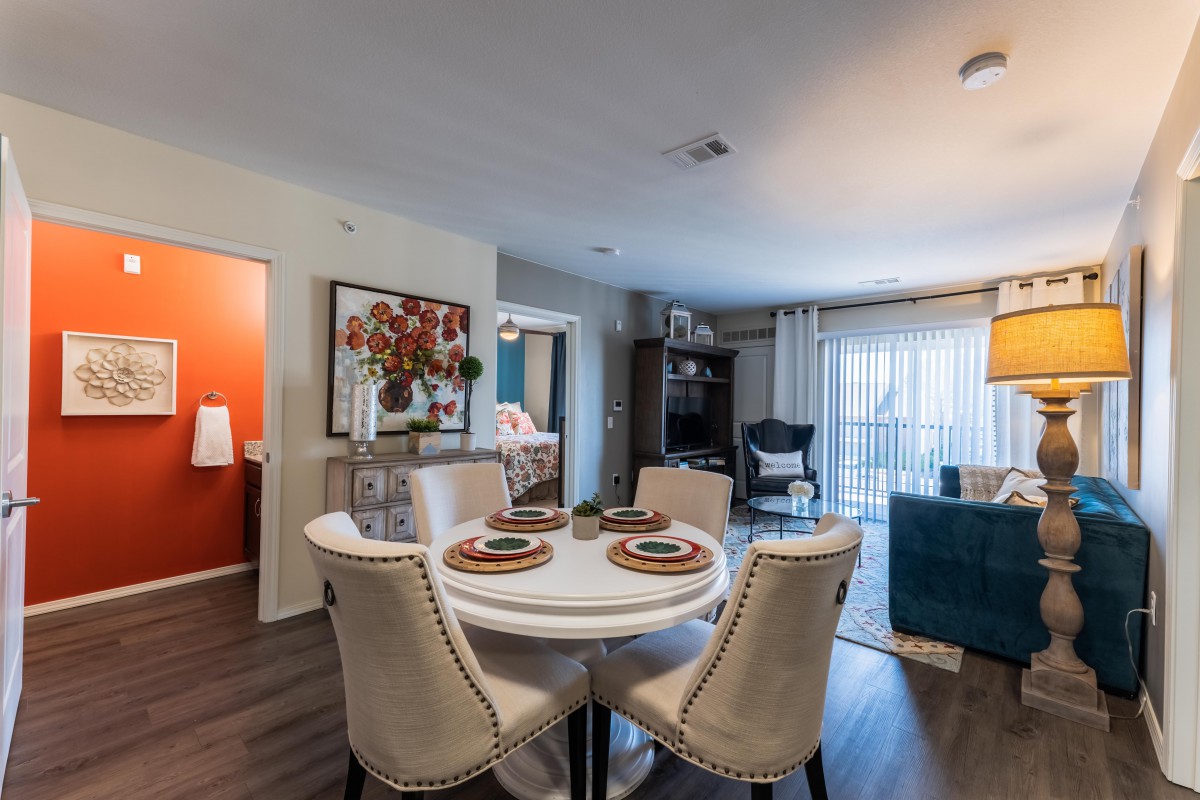 Stylish and cozy open-concept dining and living area with modern furnishings.