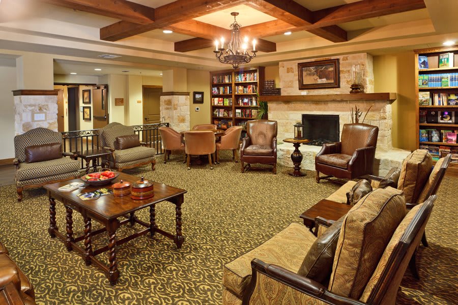 A cozy living room with a fireplace and comfortable seating.