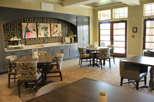 A stylish lounge area featuring modern furniture and artwork, designed for comfort and relaxation.