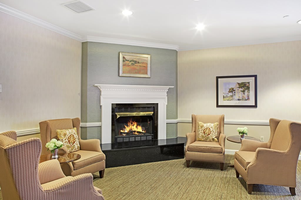 A cozy living room with a fireplace and comfortable seating.