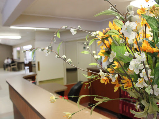 A beautifully arranged floral display greets visitors at the reception area.