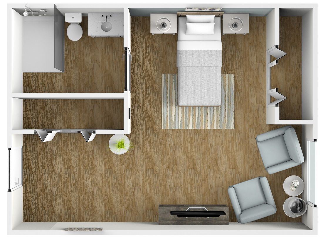 A modern bedroom floor plan with a bathroom, bed, and seating area.