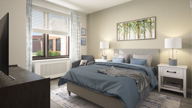 A modern bedroom interior with a cozy bed, soft lighting, and a large window.