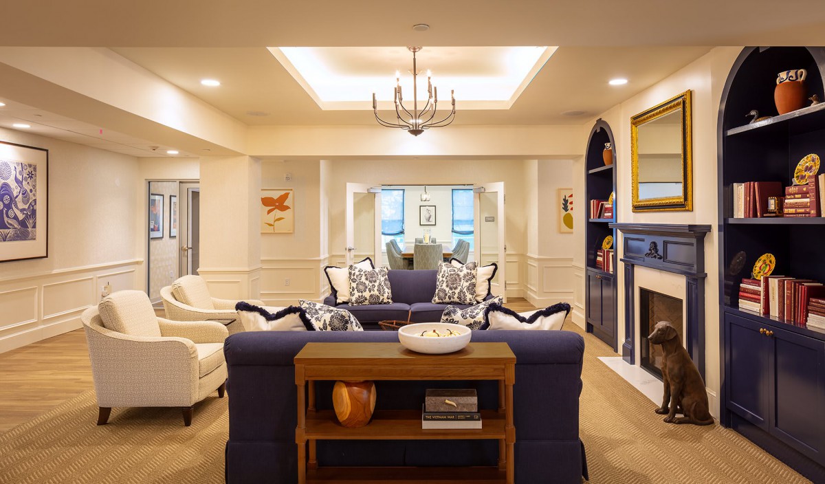 A well-decorated living room featuring comfortable seating and a cozy fireplace.