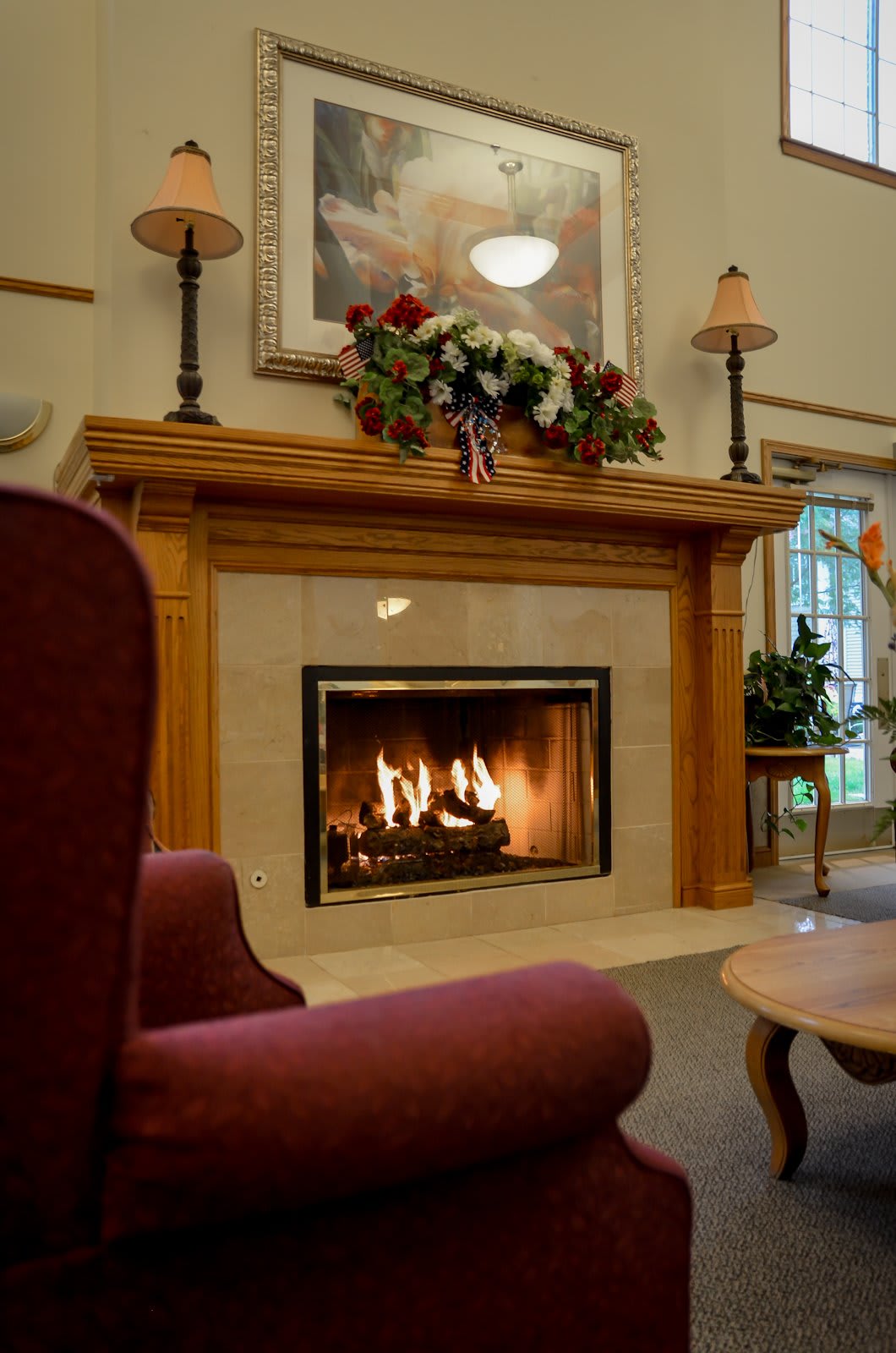 A cozy indoor setting with a warm fireplace and comfortable furniture.
