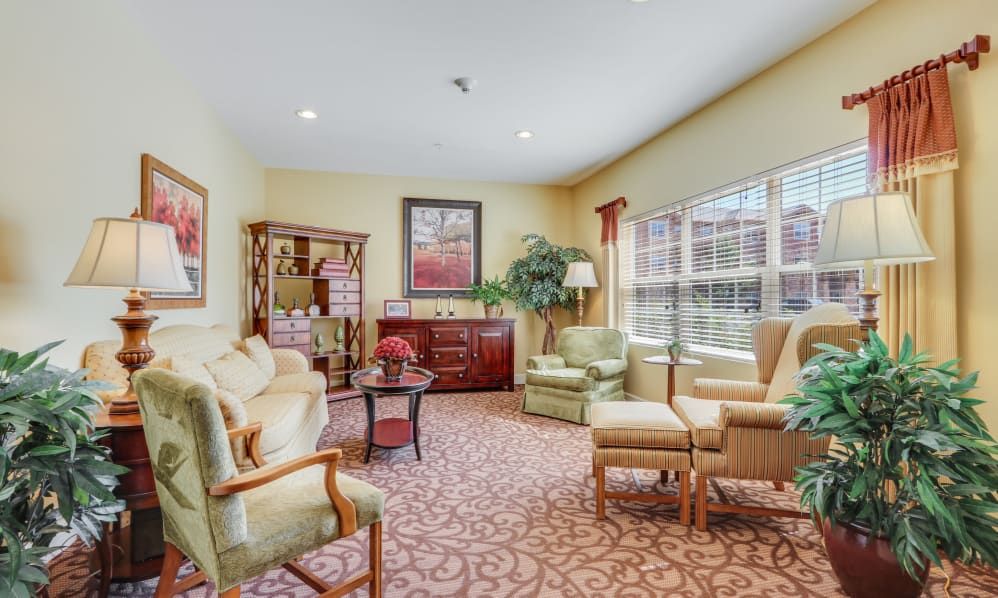 A cozy living room with comfortable seating and warm lighting.