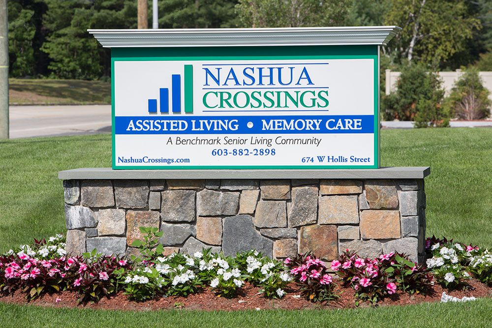 A sign for Nashua Crossings, an assisted living and memory care community.