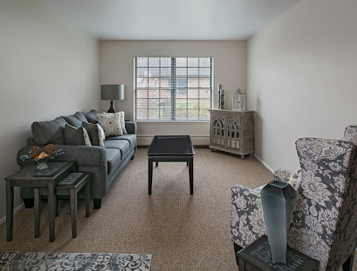 A bright and minimalist living room featuring a comfortable sofa and stylish decor.