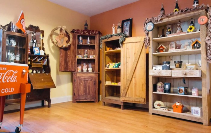 A cozy room with rustic wooden furniture and decorative items.