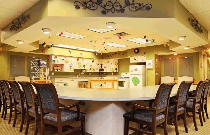 A cozy kitchen and dining area with colorful decorations and ample seating.
