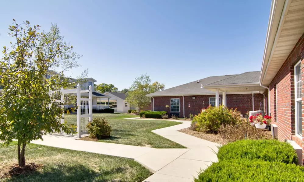 A suburban house with a well-maintained lawn and pathway.