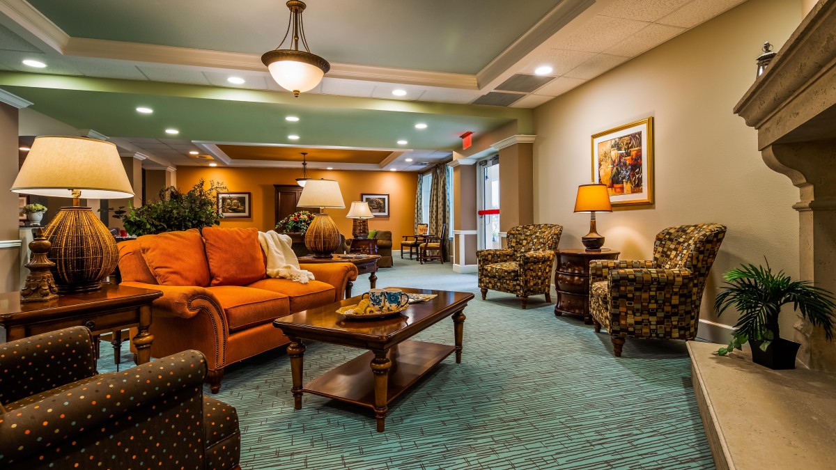A cozy living room with comfortable seating and warm lighting.
