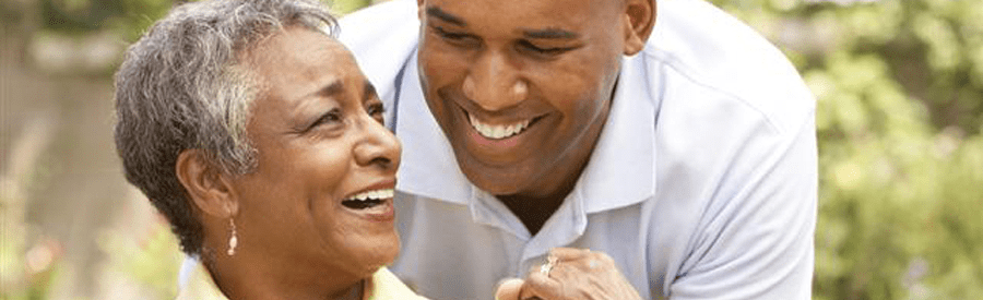 Two people sharing a happy moment, smiling and enjoying each other's company.