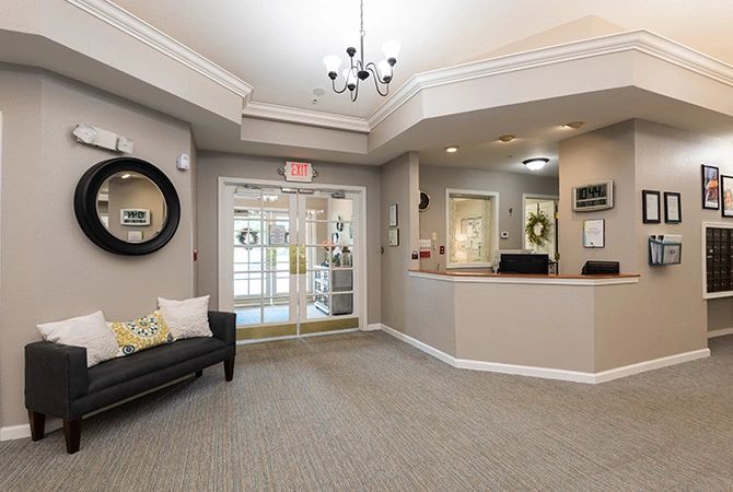 A modern reception area with a comfortable couch and a welcoming atmosphere.