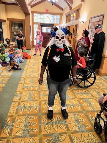 A vibrant community celebration featuring creative costumes and festive spirit.