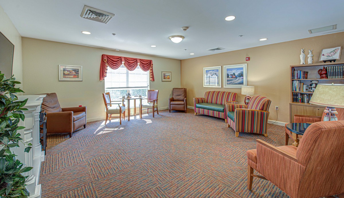 A cozy living room featuring comfortable seating and natural light.