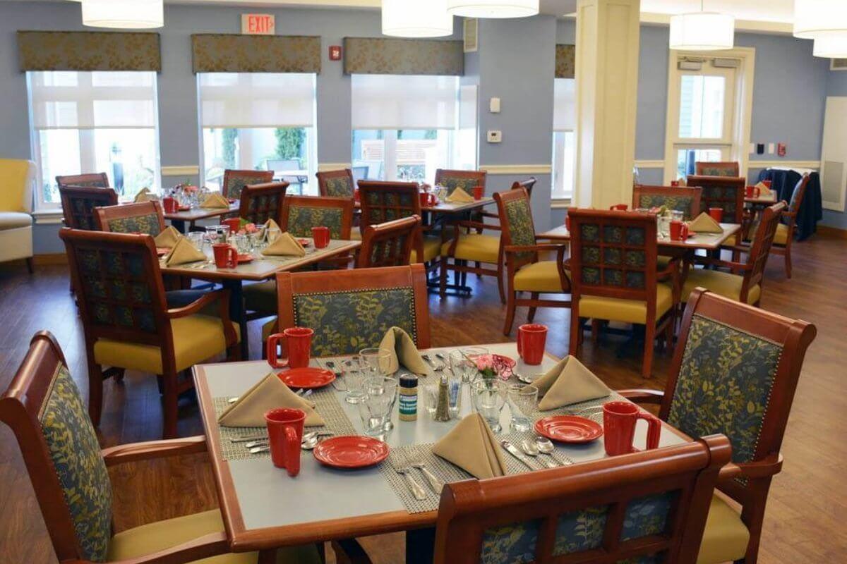 An empty dining area with neatly set tables and chairs.