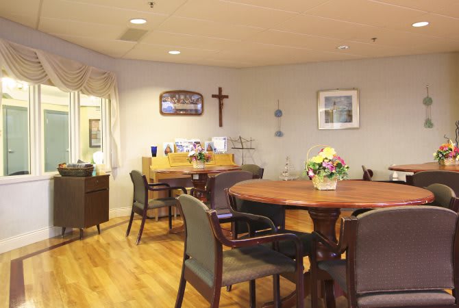 A cozy dining area with wooden furniture and decorative elements.