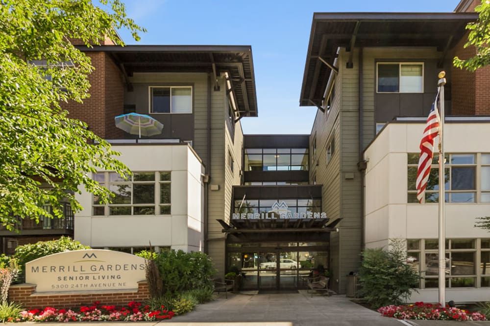 A modern residential apartment complex with a central entrance and contemporary design.