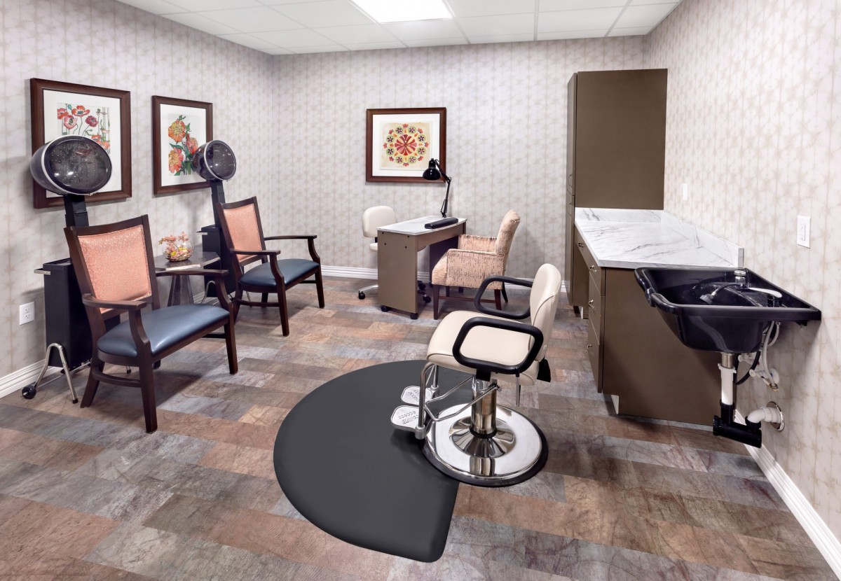 A cozy hair salon interior with stylish chairs and modern decor.