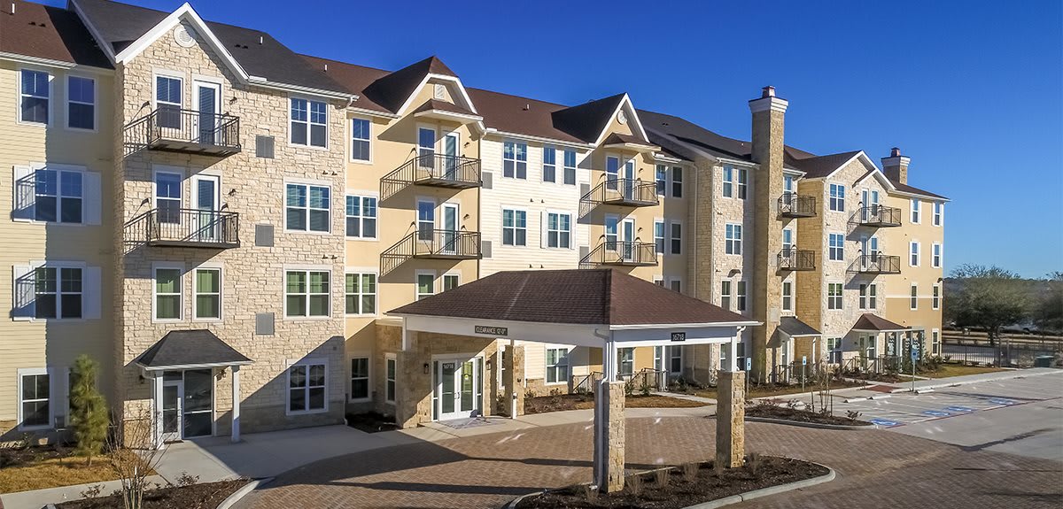 A modern residential apartment building with a welcoming entrance.