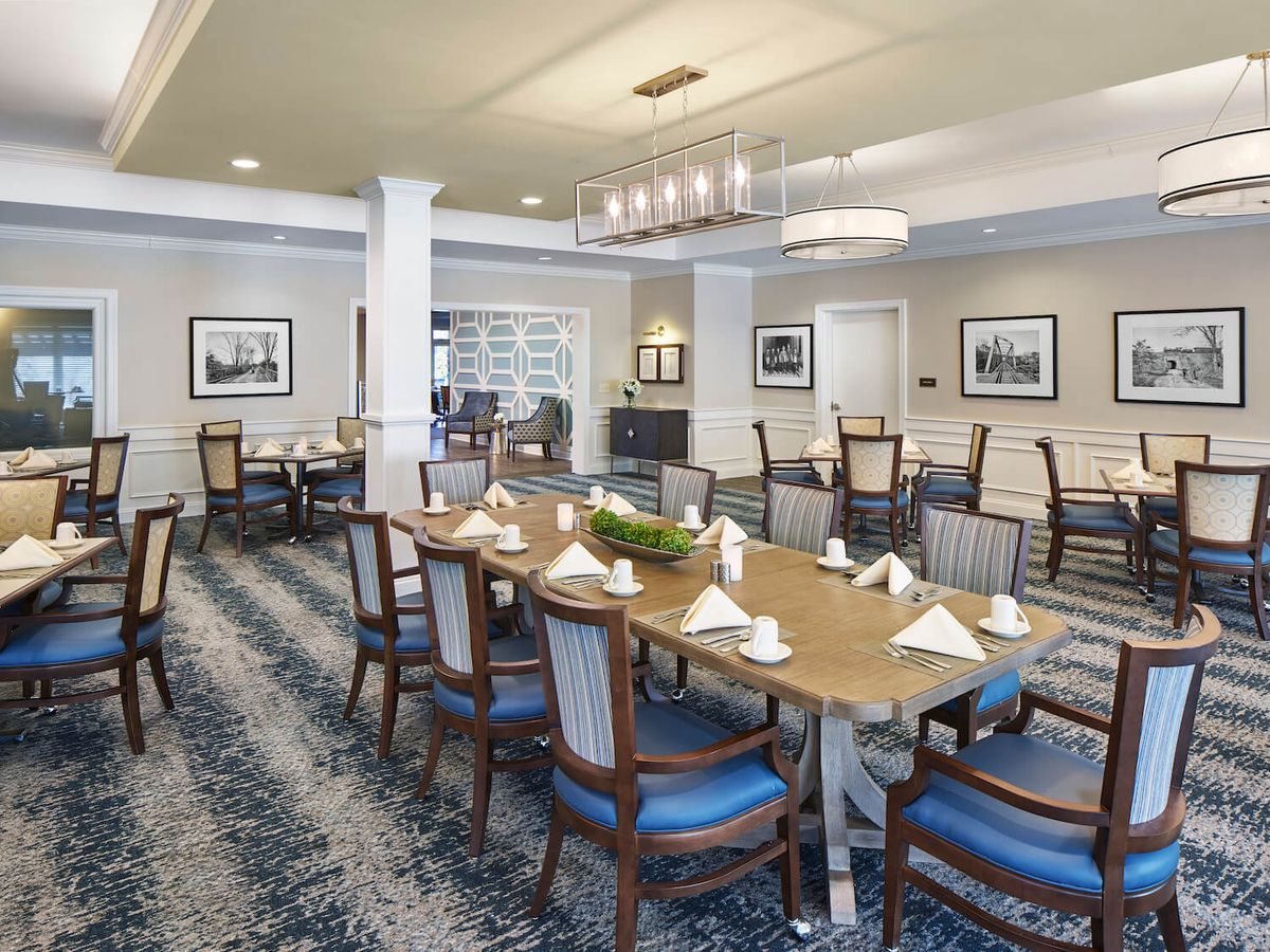 An elegant dining area with neatly arranged tables and chairs, featuring sophisticated decor.