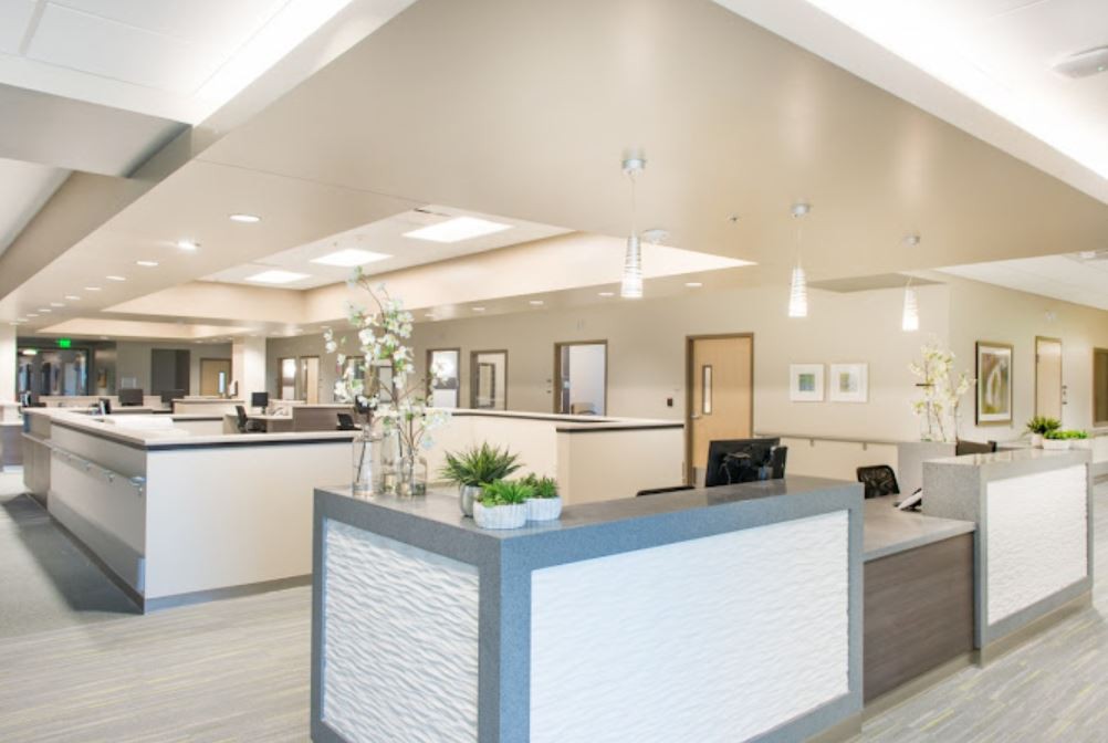 A modern reception area with minimalist decor and well-lit interior.