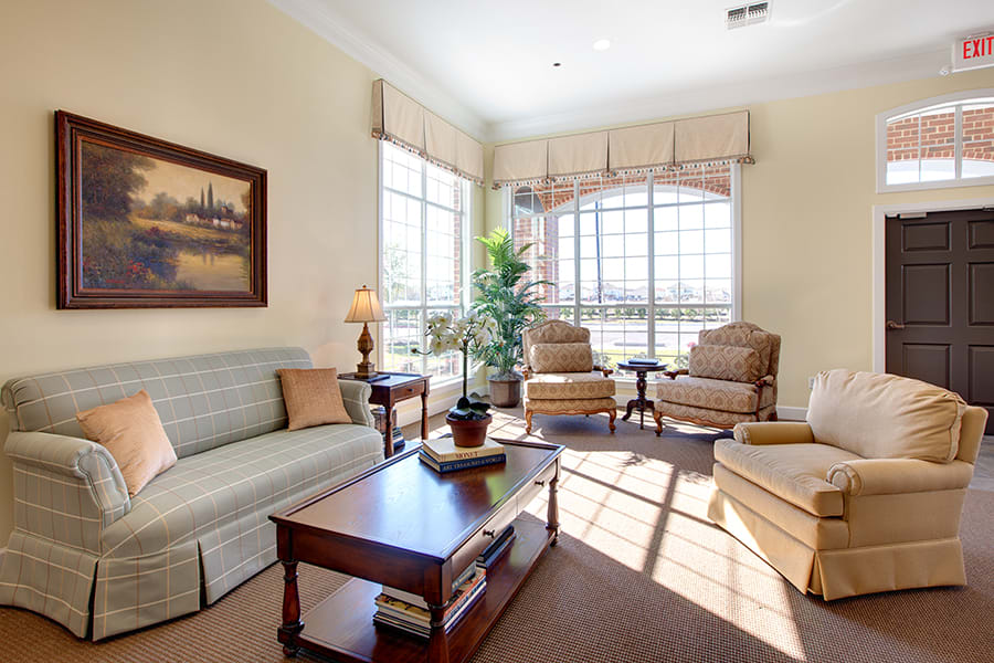 A bright and cozy living room with comfortable seating and natural light.