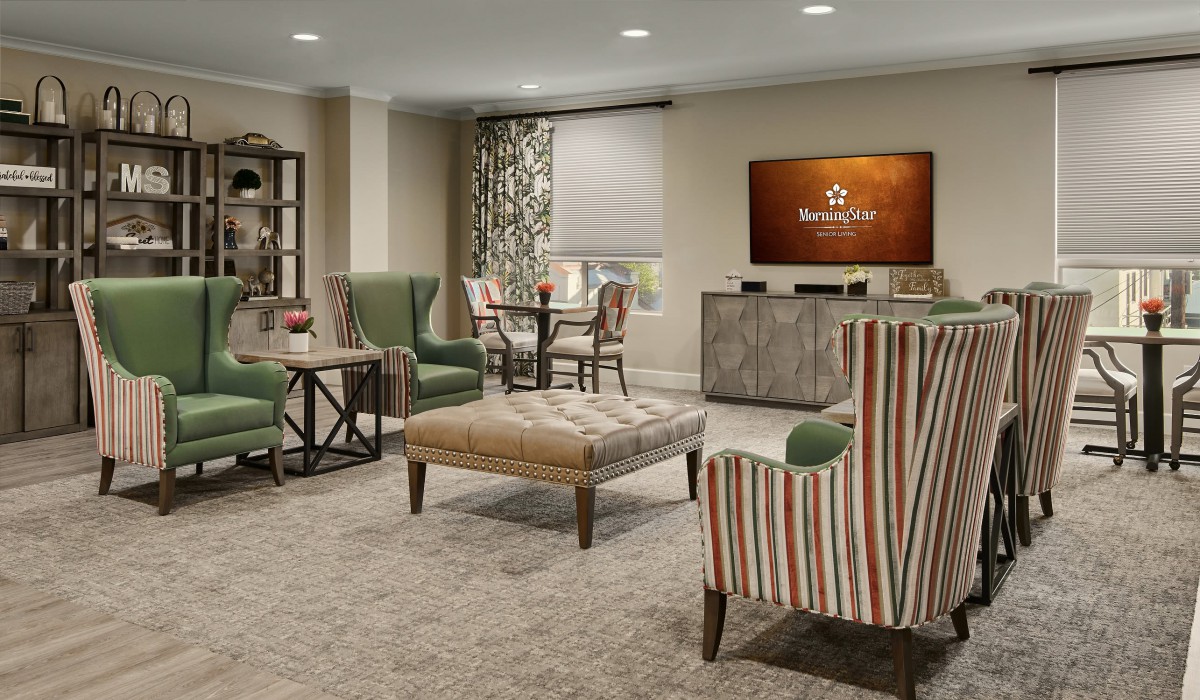 A cozy living room with comfortable seating and a television.
