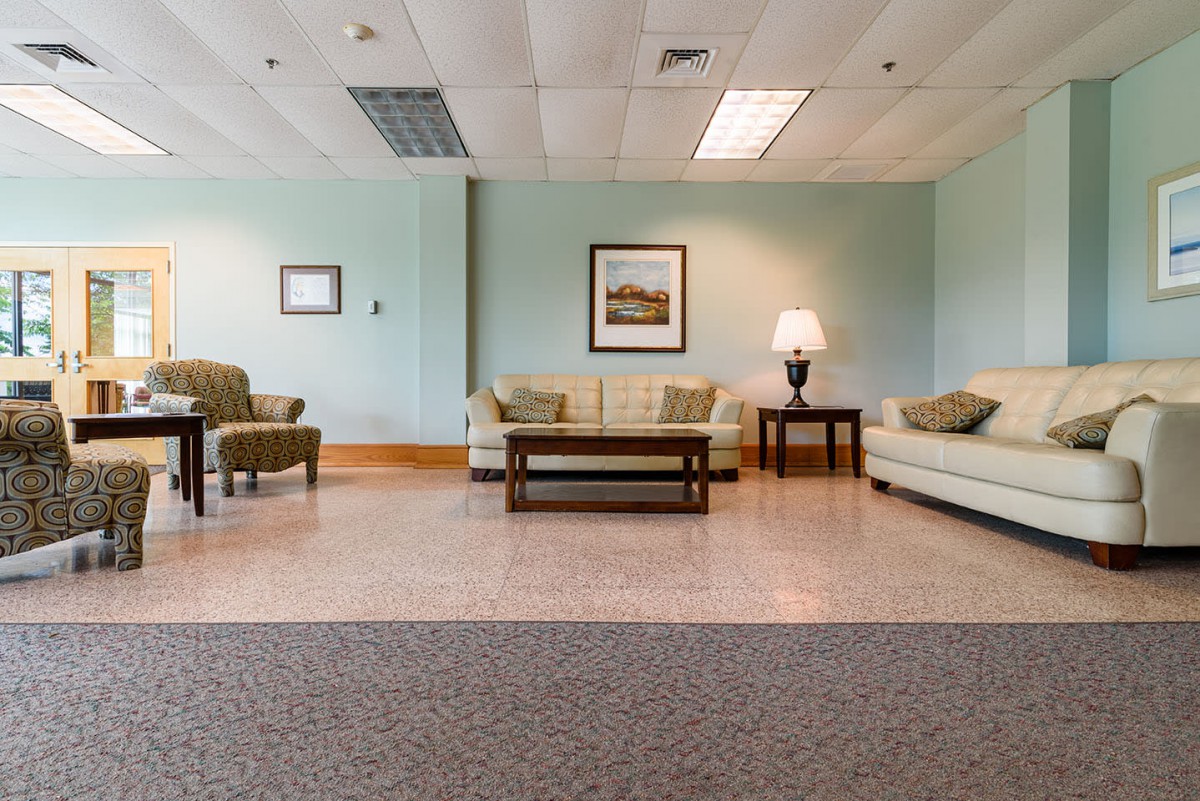 A spacious lobby area with comfortable seating and elegant decor.