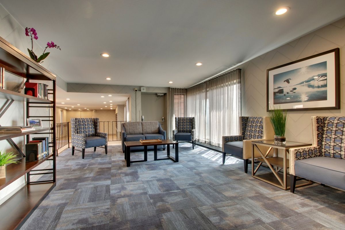 A modern lobby with comfortable seating and natural lighting.
