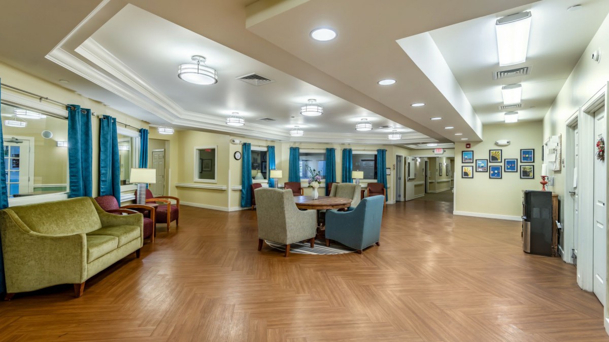 A spacious and modern lounge area with comfortable seating and ample lighting.