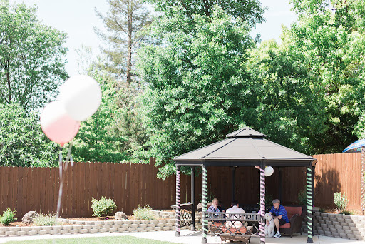 A sunny day in the garden, perfect for a relaxing gathering under the gazebo.