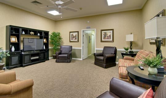 A cozy living room with comfortable seating and a television.