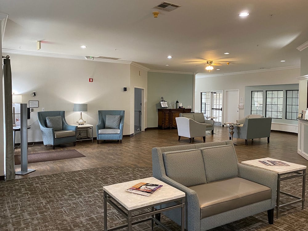 A spacious and modern lobby area with comfortable seating and soft lighting.