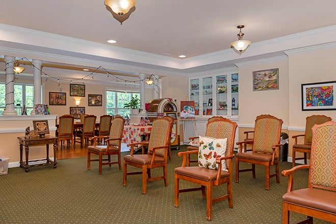A cozy living room with ample seating and warm lighting.