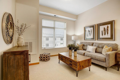 A cozy and stylish living room featuring a comfortable sofa, elegant coffee table, and abundant natural light.