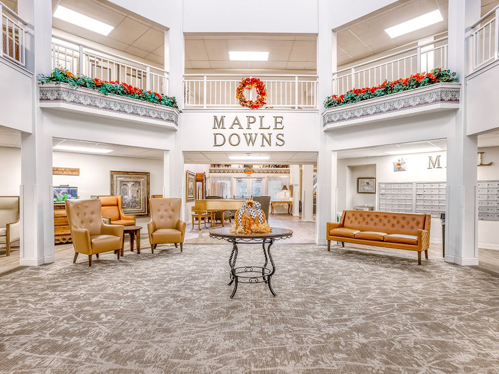 The lobby of Maple Downs featuring comfortable seating and festive holiday decor.